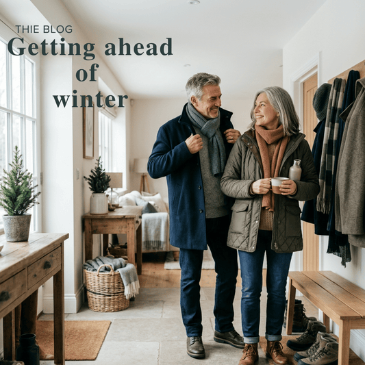 Couple preparing to go outside for a winter walk